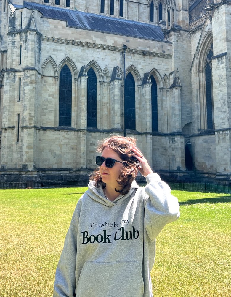Iryna Kostiuk outdoors in front of a Gothic cathedral